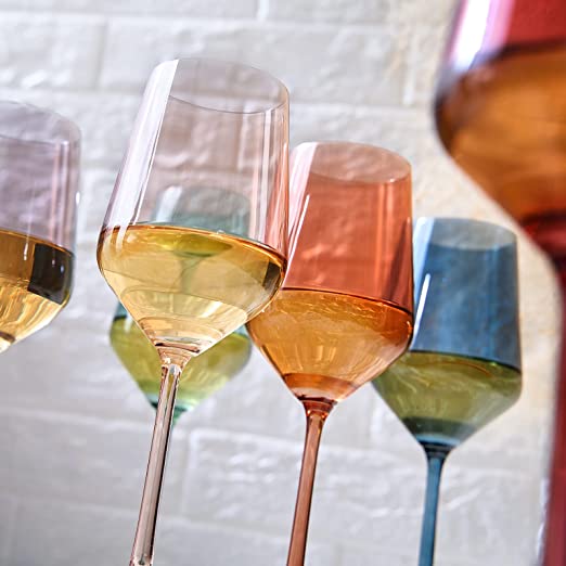 Set of 6 colored stemmed wine glasses on a table setting