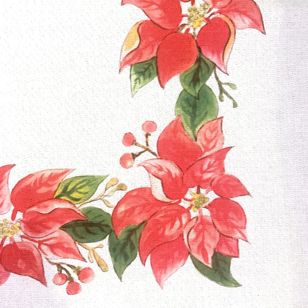 Magnolia Creative Co Poinsettia Wreath kitchen towel hanging in a kitchen