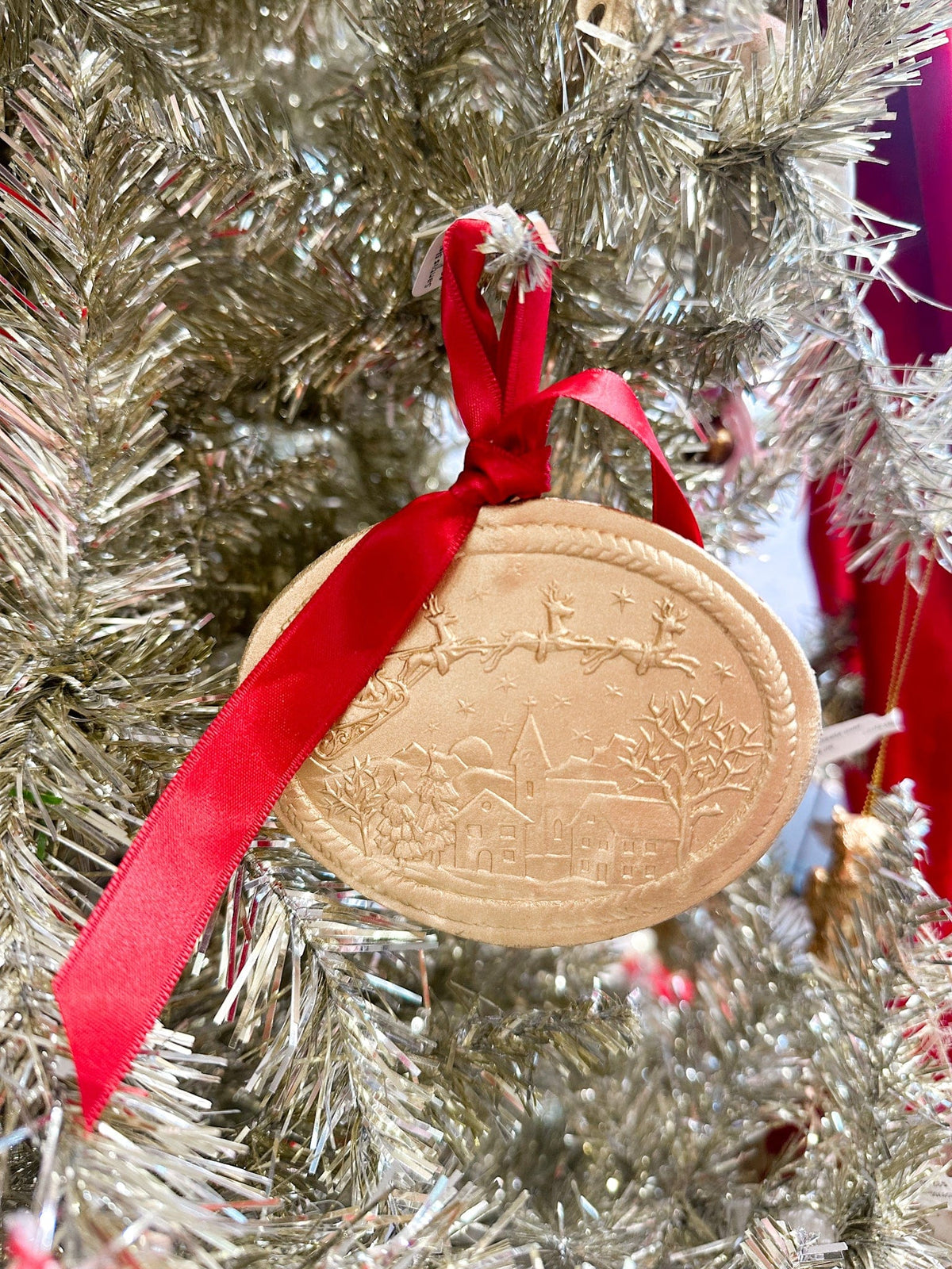 Santa on his sleigh gold ornament for tree