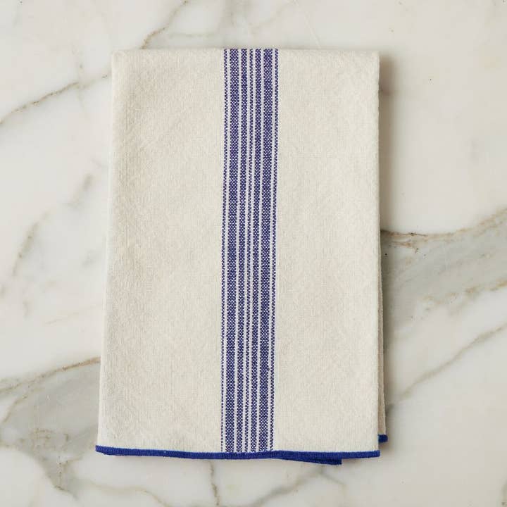 Beige towel with blue striped border