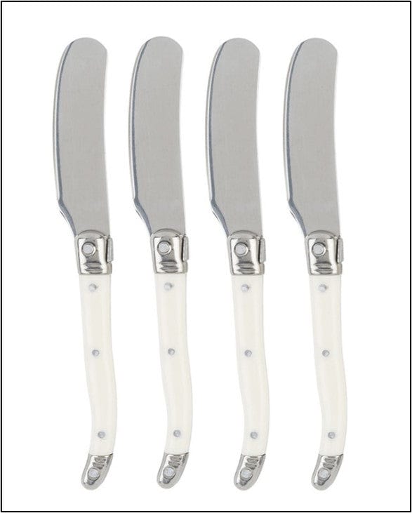 Four butter knives with white handles and silver blades on a white background