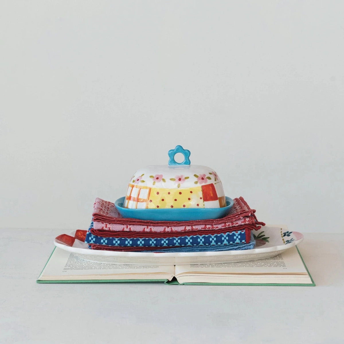 Creative Co-op Hand-Painted Stoneware Butter Dish with Pattern & Flower Shaped Handle - Little Miss Muffin Children & Home