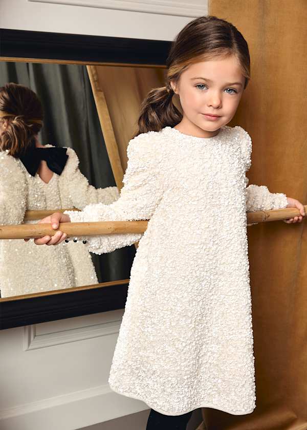 sequin dress with black velvet bow in back