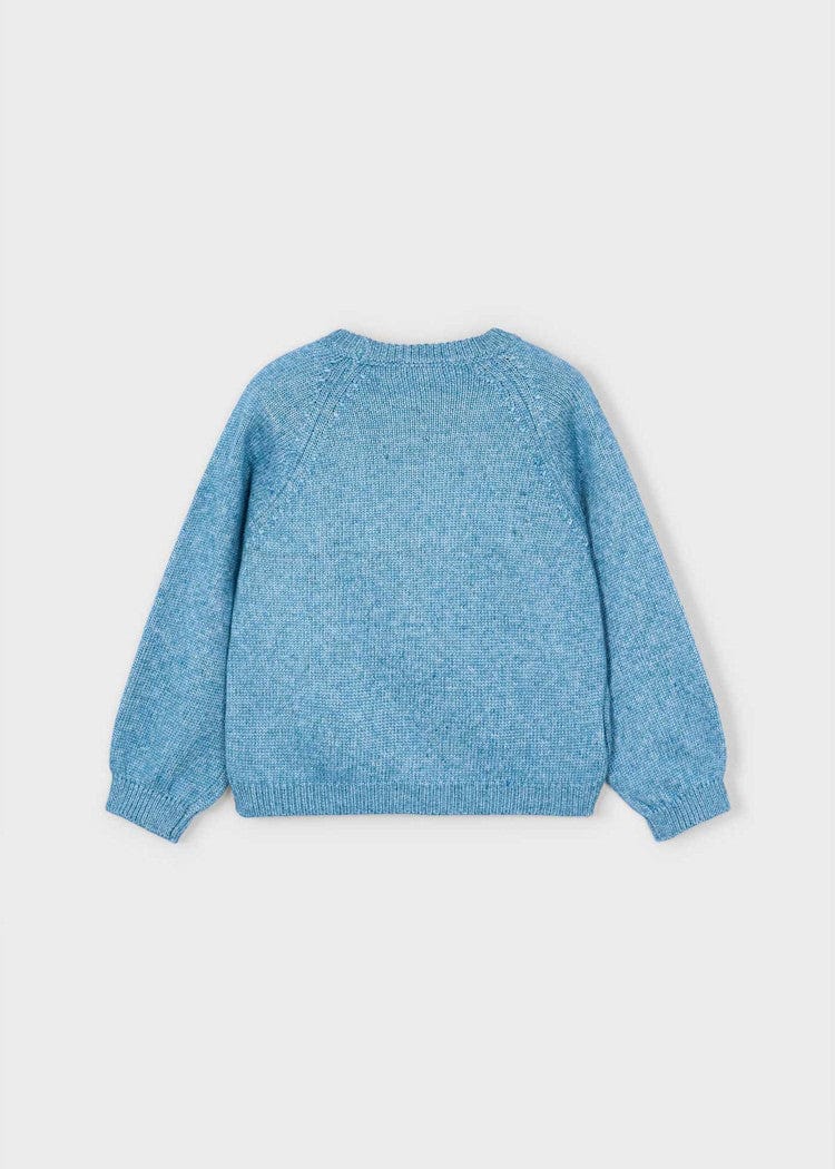 back of blue sweater with applique flower