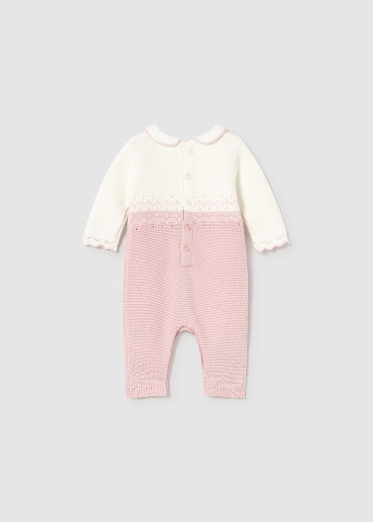 back of pink knit romper