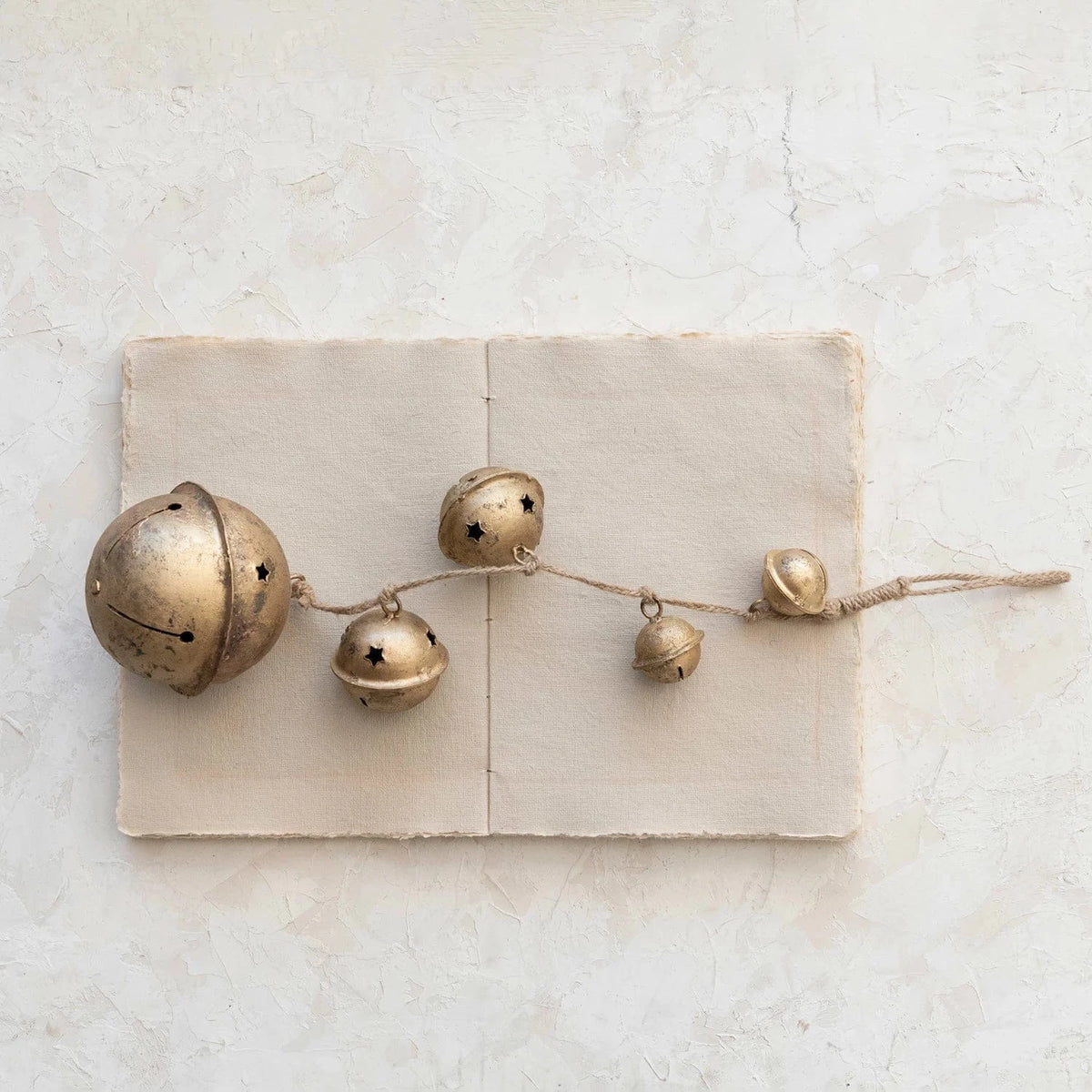 Creative Co-op Hanging Metal Bells with Star Cut-Outs on Braided Jute Rope, Antique Gold Finish - Little Miss Muffin Children & Home
