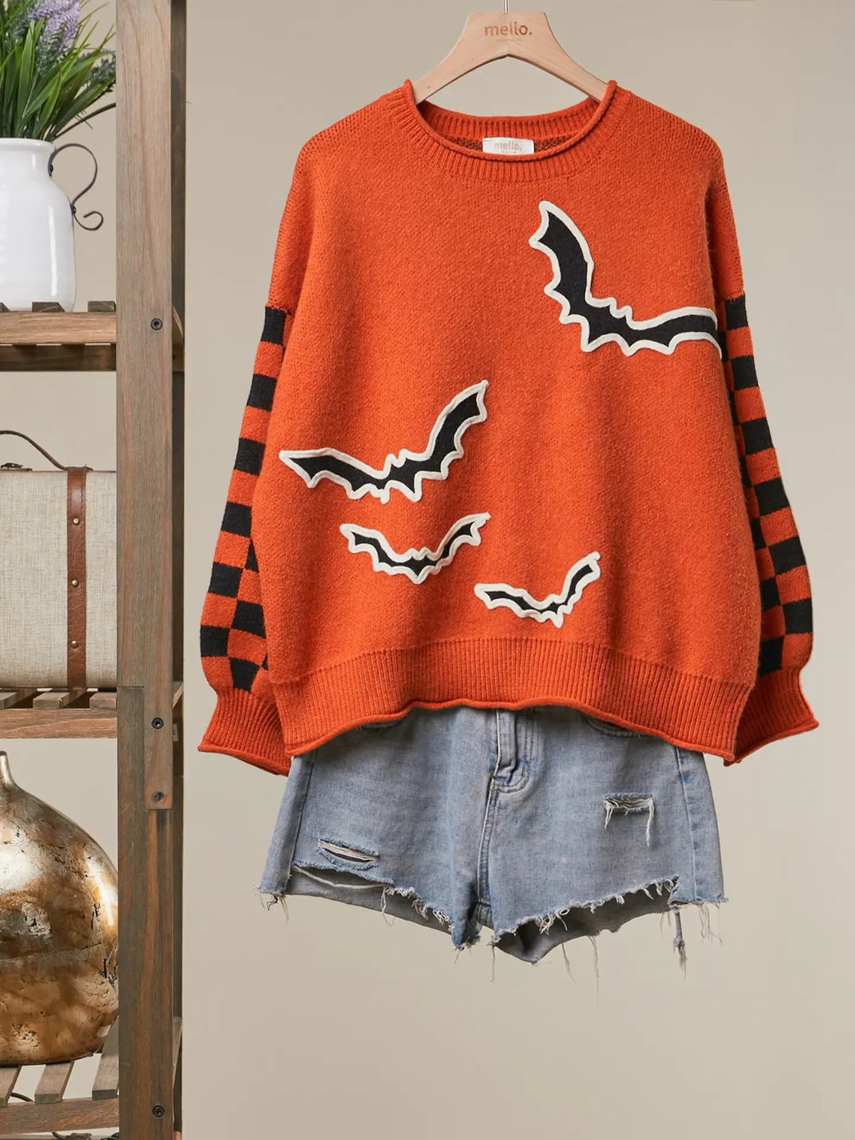 Checkerboard Sleeve Bats Sweater