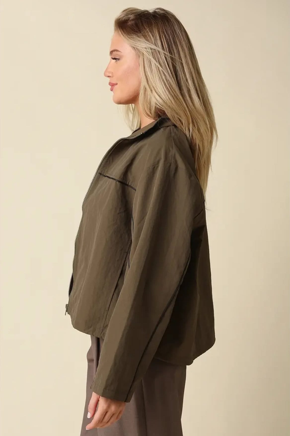 Side view of Alina cropped olive jacket showing relaxed drop-shoulder fit