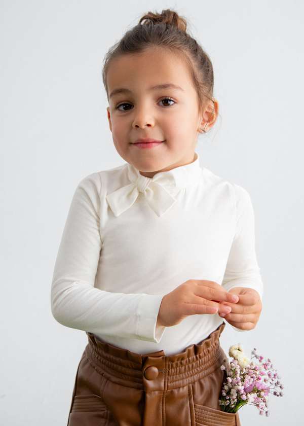 white turtleneck with bow tie